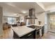 Modern kitchen island with stainless steel stove and open floor plan at 782 W Gail Dr, Chandler, AZ 85225