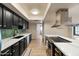 Open kitchen with stainless steel appliances and stone countertops at 782 W Gail Dr, Chandler, AZ 85225