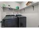 Laundry room featuring shelving, a washer, and dryer, providing convenience and organization at 782 W Gail Dr, Chandler, AZ 85225
