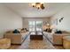 Symmetrical living room showcasing dual sofas, bright windows and stylish decor at 782 W Gail Dr, Chandler, AZ 85225