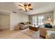 Bright living area featuring modern furniture, a ceiling fan and light laminate flooring at 782 W Gail Dr, Chandler, AZ 85225