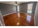 Well-lit bedroom with hardwood floors and two windows providing natural light at 7903 N 61St Ave, Glendale, AZ 85301