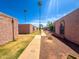 Exterior view of townhouses with desert landscaping and inviting walkways at 7903 N 61St Ave, Glendale, AZ 85301