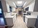 Bright kitchen with white cabinetry, stainless steel appliances, and quartz countertops at 7903 N 61St Ave, Glendale, AZ 85301