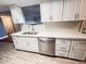 Bright kitchen features white cabinets, stainless steel appliances, and a modern quartz countertop at 7903 N 61St Ave, Glendale, AZ 85301