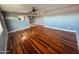 Open living room features wood floors and a view into the bright kitchen at 7903 N 61St Ave, Glendale, AZ 85301