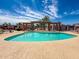 Community pool with lounge seating on a sunny day at 7903 N 61St Ave, Glendale, AZ 85301