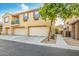 Exterior shot of building with two garages, balcony, and nice landscaping at 8113 W Groom Creek Rd, Phoenix, AZ 85043