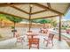 A community gazebo features a table, chairs, and a grill, offering a perfect spot for outdoor gatherings and relaxation at 8113 W Groom Creek Rd, Phoenix, AZ 85043