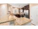 Kitchen features dark cabinetry, granite countertops, and stainless steel appliances at 8113 W Groom Creek Rd, Phoenix, AZ 85043