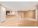 Open-concept living area features tile floors, neutral paint, and staircase at 8113 W Groom Creek Rd, Phoenix, AZ 85043