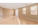 Spacious living room with natural light, ceiling fan, and sliding glass door at 8113 W Groom Creek Rd, Phoenix, AZ 85043