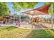 A covered playground area with slides, climbing structures, and shaded seating, providing a fun and safe environment for children at 8113 W Groom Creek Rd, Phoenix, AZ 85043
