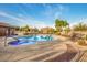 A community swimming pool and hot tub are surrounded by comfortable lounge chairs, perfect for relaxation and recreation at 8113 W Groom Creek Rd, Phoenix, AZ 85043