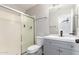 Bathroom with a new vanity, modern fixtures, and a shower with a glass door at 8433 E Natal Cir, Mesa, AZ 85209