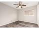 An empty bedroom with laminate flooring, light walls, and a ceiling fan at 8433 E Natal Cir, Mesa, AZ 85209