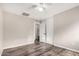 This bedroom features wood floors, base trim, neutral colored walls, and ceiling fan at 8433 E Natal Cir, Mesa, AZ 85209
