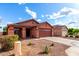 Single-story home with low-maintenance desert landscaping, a two-car garage, and a friendly, inviting neighborhood setting at 8433 E Natal Cir, Mesa, AZ 85209