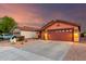 Attractive single-story home featuring desert landscaping, a two-car garage, and a cozy, neighborhood setting at 8433 E Natal Cir, Mesa, AZ 85209