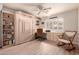Inviting bedroom featuring a Murphy bed and built-in desk and shelving at 8818 N 47Th Ln, Glendale, AZ 85302