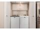 Convenient laundry room equipped with a washer and dryer at 8818 N 47Th Ln, Glendale, AZ 85302
