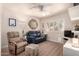 Cozy living room with comfortable seating, shutters, and modern decor at 8818 N 47Th Ln, Glendale, AZ 85302