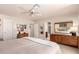 Spacious main bedroom with ample closet space and ceiling fan at 8818 N 47Th Ln, Glendale, AZ 85302