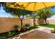 Private patio space featuring an artificial lawn and a variety of potted plants for a serene setting at 8818 N 47Th Ln, Glendale, AZ 85302