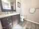Bathroom featuring a vanity with drawers, a toilet, and a neutral-colored walls and flooring at 8865 E Baseline Rd # 614, Mesa, AZ 85209