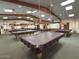 Spacious billiards room with multiple tables and overhead lighting, perfect for community gatherings at 8865 E Baseline Rd # 614, Mesa, AZ 85209