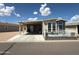 Charming home featuring a carport and front patio area, perfect for relaxing and enjoying the outdoors at 8865 E Baseline Rd # 614, Mesa, AZ 85209