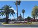 Beautiful fountain surrounded by lush landscaping and palm trees, enhancing the community's appeal at 8865 E Baseline Rd # 614, Mesa, AZ 85209