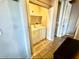 Functional laundry room with washer, dryer, and storage shelves for convenience and organization at 8865 E Baseline Rd # 614, Mesa, AZ 85209