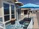 Cozy patio seating area with a blue umbrella, perfect for enjoying the outdoors at 8865 E Baseline Rd # 614, Mesa, AZ 85209