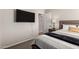 Cozy bedroom featuring a TV and view of the hallway at 901 N Quartz St, Gilbert, AZ 85234