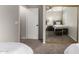 Bedroom with mirrored closet doors and a ceiling fan, showcasing carpet flooring at 901 N Quartz St, Gilbert, AZ 85234