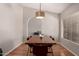 Dining room features an elegant pendant light fixture and hardwood floors at 901 N Quartz St, Gilbert, AZ 85234