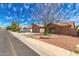 A well-maintained single-story home with desert landscaping and a tidy front yard on a sunny day at 901 N Quartz St, Gilbert, AZ 85234
