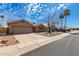 Charming single-story home with a well-maintained front yard, two-car garage, and desert landscaping at 901 N Quartz St, Gilbert, AZ 85234