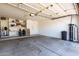 Spacious garage with ample storage shelves, ready for vehicles and projects at 901 N Quartz St, Gilbert, AZ 85234