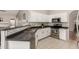 Well-lit kitchen featuring stainless steel appliances and a stylish tile backsplash at 901 N Quartz St, Gilbert, AZ 85234