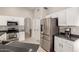 Modern kitchen with stainless steel appliances and sleek countertops at 901 N Quartz St, Gilbert, AZ 85234