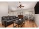 Comfortable living room with hardwood floors, ceiling fan, and great natural light at 901 N Quartz St, Gilbert, AZ 85234