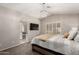 A spacious bedroom with a view of the bathroom and a modern light fixture at 901 N Quartz St, Gilbert, AZ 85234