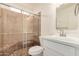 Elegant bathroom featuring a glass shower with bench, vanity, and modern fixtures at 908 S Kachina --, Mesa, AZ 85204