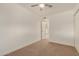 Neutral carpeted bedroom with fan and a closet, offering a calm retreat at 908 S Kachina --, Mesa, AZ 85204