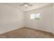 A light bedroom with neutral walls and carpet, complemented by a bright window at 908 S Kachina --, Mesa, AZ 85204