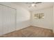 Bedroom with closet, ceiling fan, and a bright window overlooking the outdoors at 908 S Kachina --, Mesa, AZ 85204