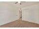 Bedroom with neutral carpet, ceiling fan, and a closet for organized storage at 908 S Kachina --, Mesa, AZ 85204