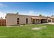 A bright single-story brick home featuring well-kept lawn and a tiled awning over the entrance at 908 S Kachina --, Mesa, AZ 85204
